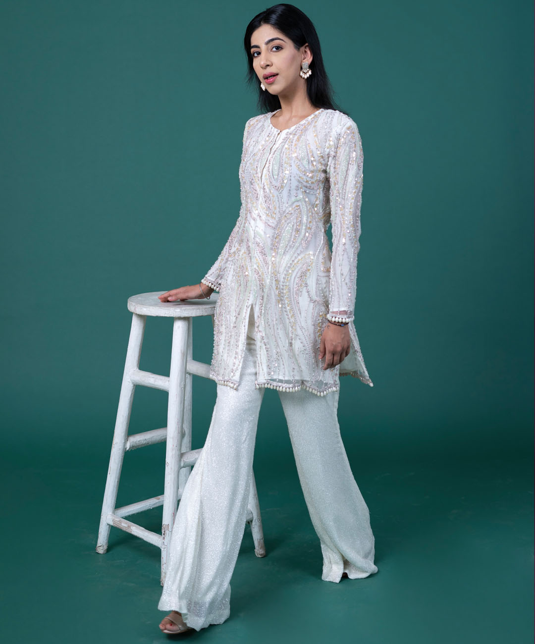 White embroidered kurta with shimmer trousers